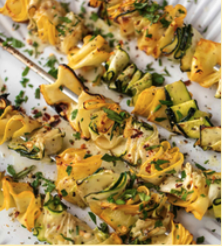 Zucchini ribbon skewers with lemon sauce